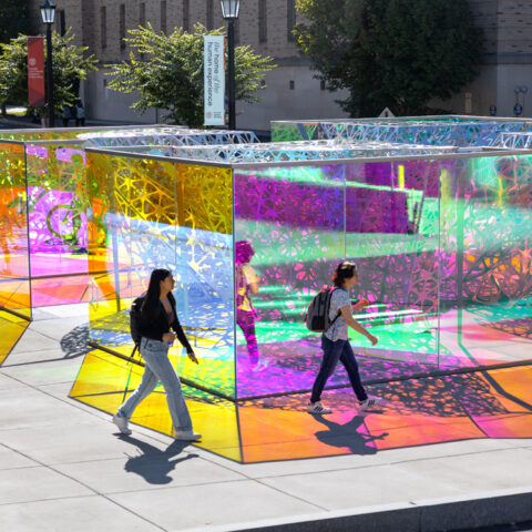 Students pass by the PolyForm sculpture near Martha Van Rennsselear Hall.